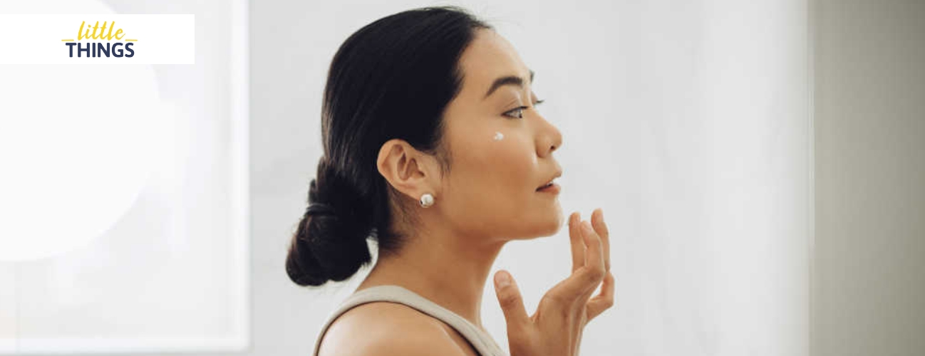 Image of woman applying Age IQ Double Cleansing Face Wash to her face.